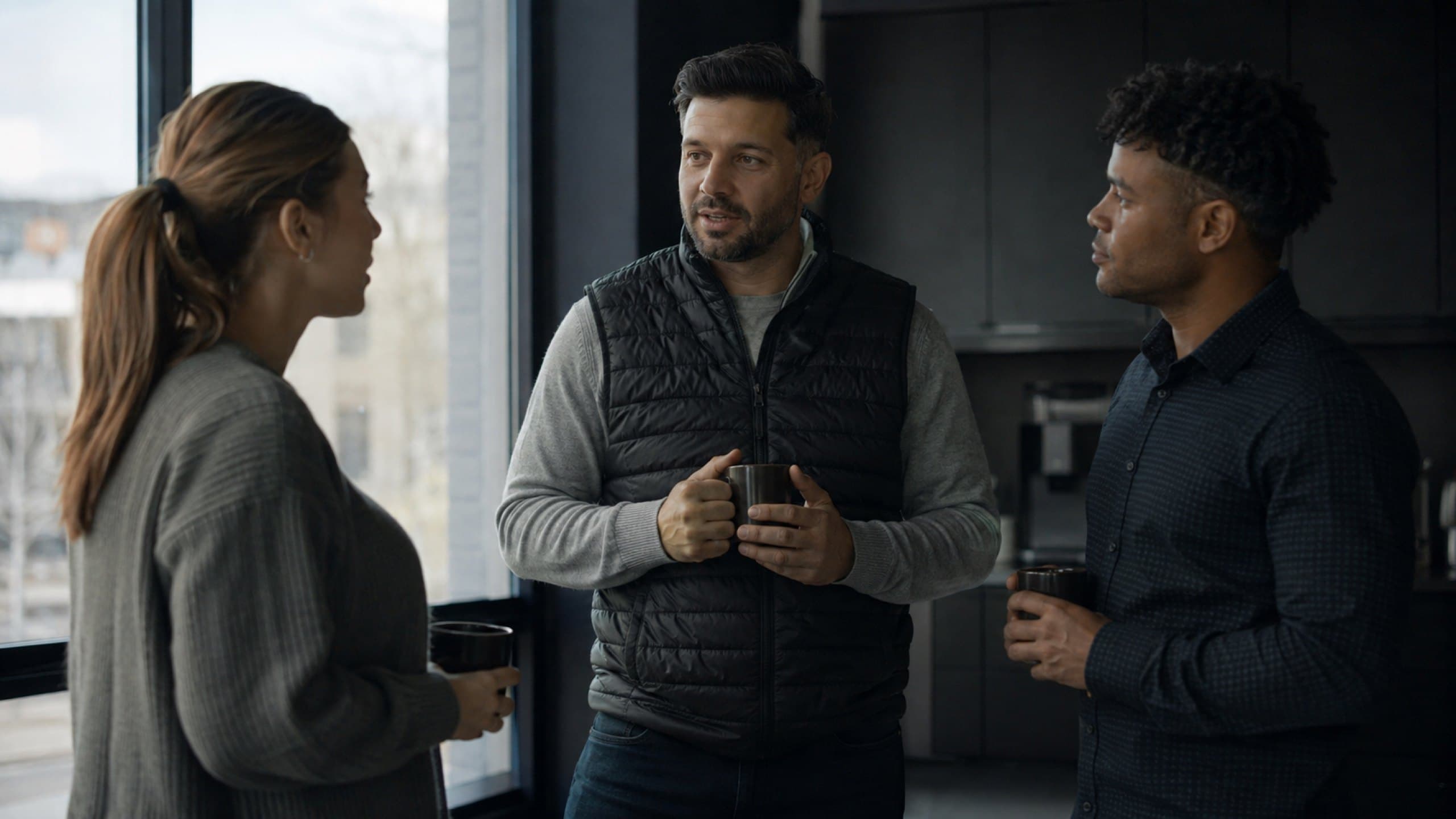 A small sales team working together at a table
